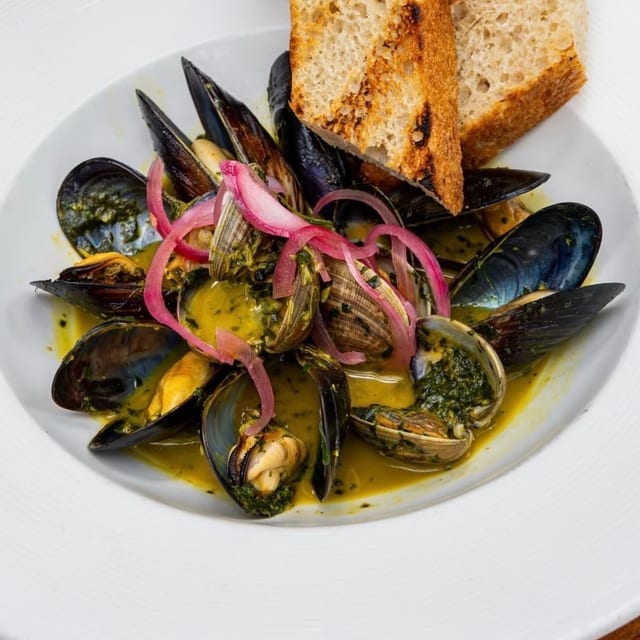Steamed Mediterranean Mussels with Grilled Focaccia Bread.